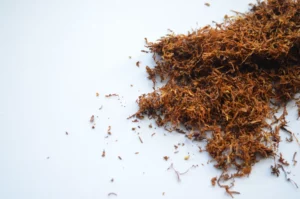 Close-up of premium shisha tobacco leaves ready for hookah preparation.